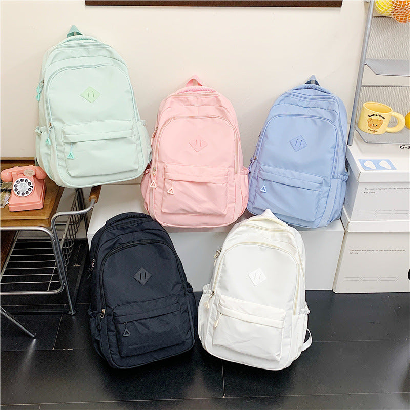 New Simple Color Backpack with Large Capacity, Lightweight and Stylish for Students and Travel